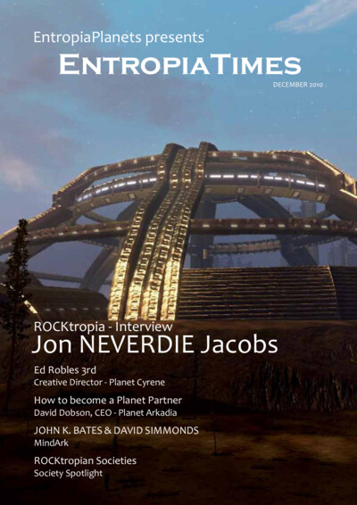 Cover of EntropiaTimes December 2010 magazine featuring a futuristic structure with illuminated ramps against a dusky sky. The cover text highlights interviews with Jon NEVERDIE Jacobs, Ed Robles 3rd, John K. Bates, David Simmonds, and a guide on becoming