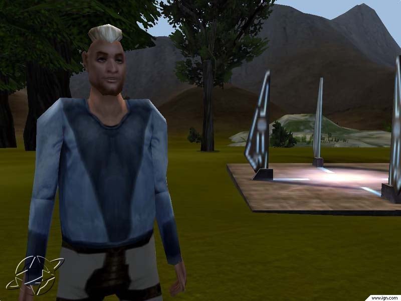An avatar with a light blue shirt and gray shorts stands near a glowing teleportation device in a grassy area surrounded by mountains.