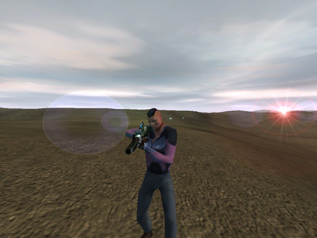 An avatar holding a weapon stands in a dry, open terrain under a cloudy sky.