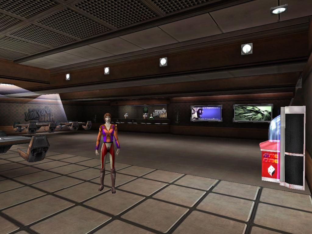 An avatar in a colorful outfit stands in the Junkyard Bar, surrounded by screens and a vending machine.