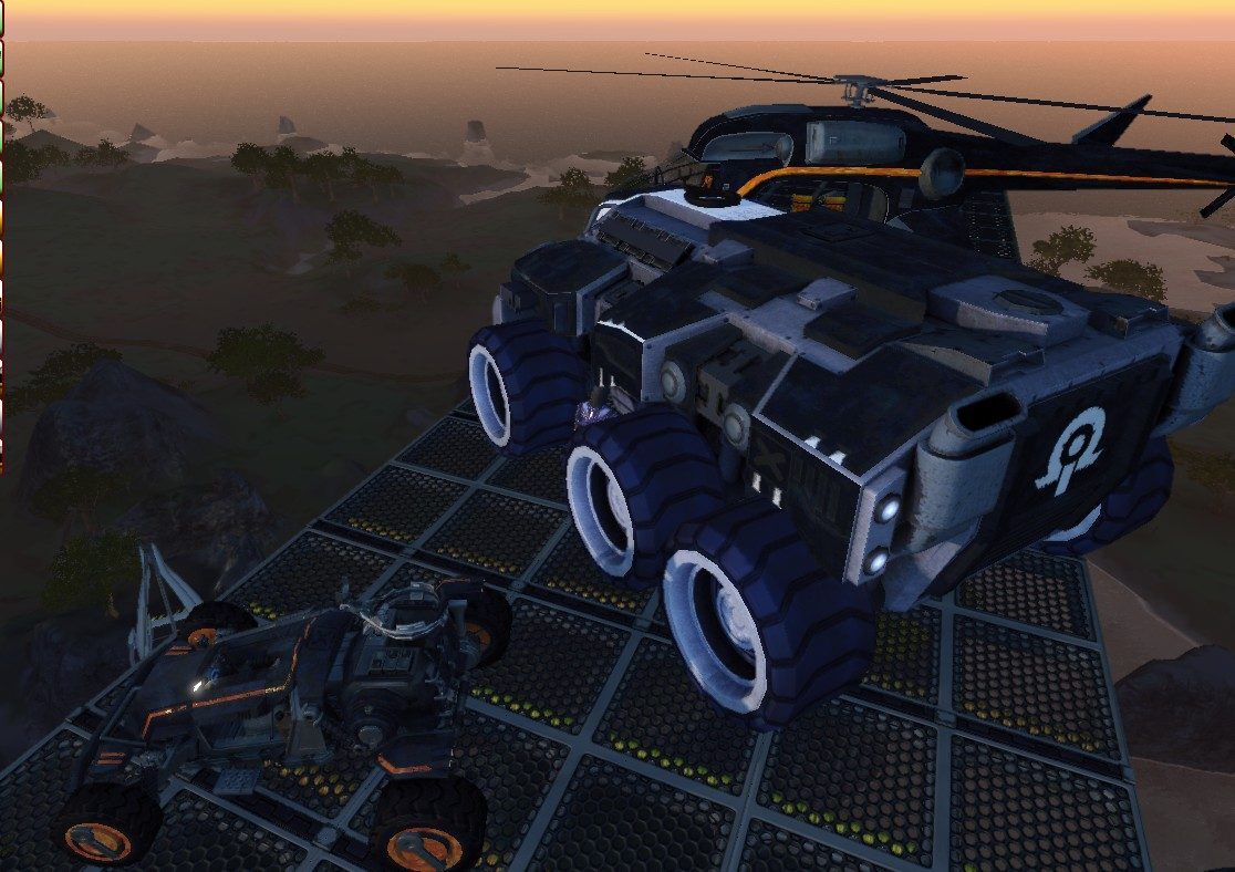 A large vehicle with big wheels and a helicopter on a platform, with a smaller vehicle next to it, set against a sunset backdrop.