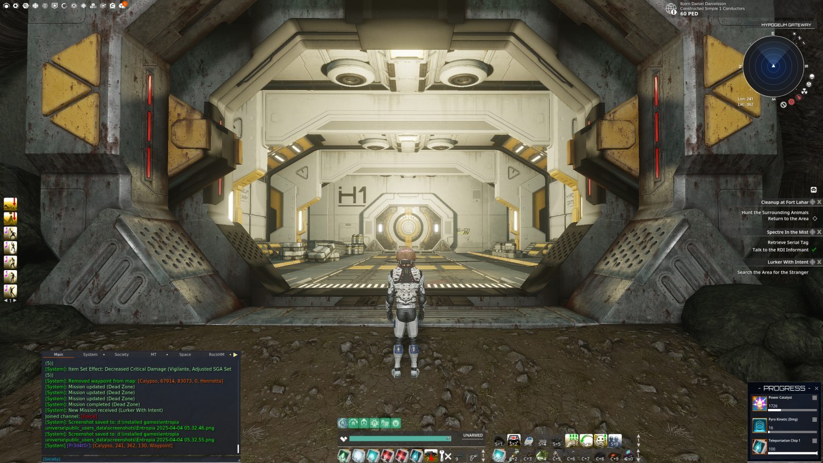 A player in a futuristic suit stands at the entrance of the Hypogium Gateway, surrounded by metallic structures and a rocky ground. The interior is brightly lit with yellow accents, and various UI elements are visible on the screen, showing mission update